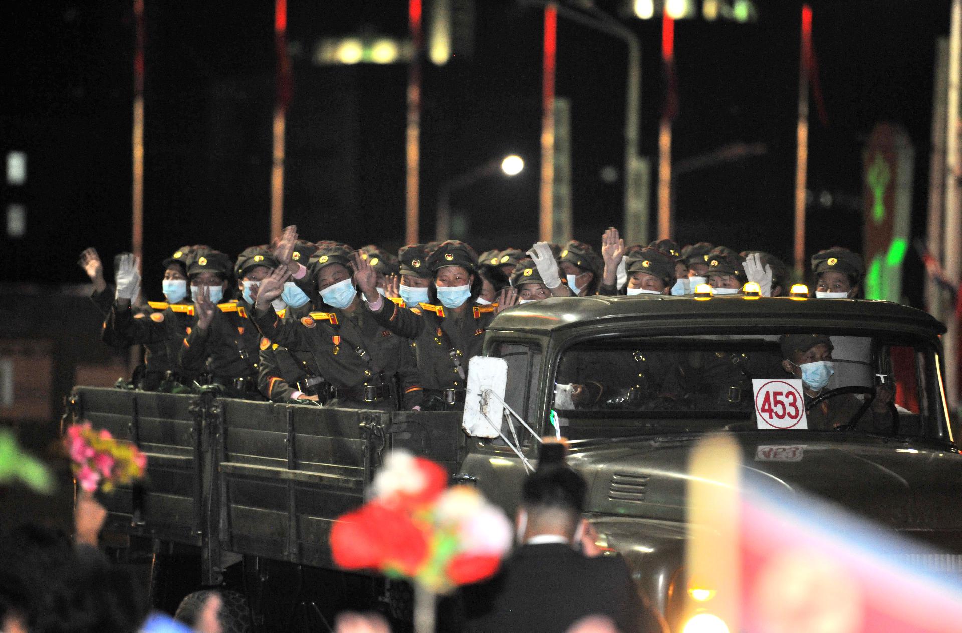 Participants of the military parade for celebrating the 75th founding anniversary of the Workers’ Party of Korea traverse streets of the capital warmly received by citizens of Pyongyang
