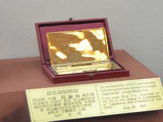 gift to President <nobr><strong><b>Kim Il Sung</b></strong></nobr> from Josip Broz Tito, chairman of the Central Committee of the Communists League of Yugoslavia and president of the Socialist Federal Republic of Yugoslavia-Gold Plated Cigarette Case, August 25, 1977